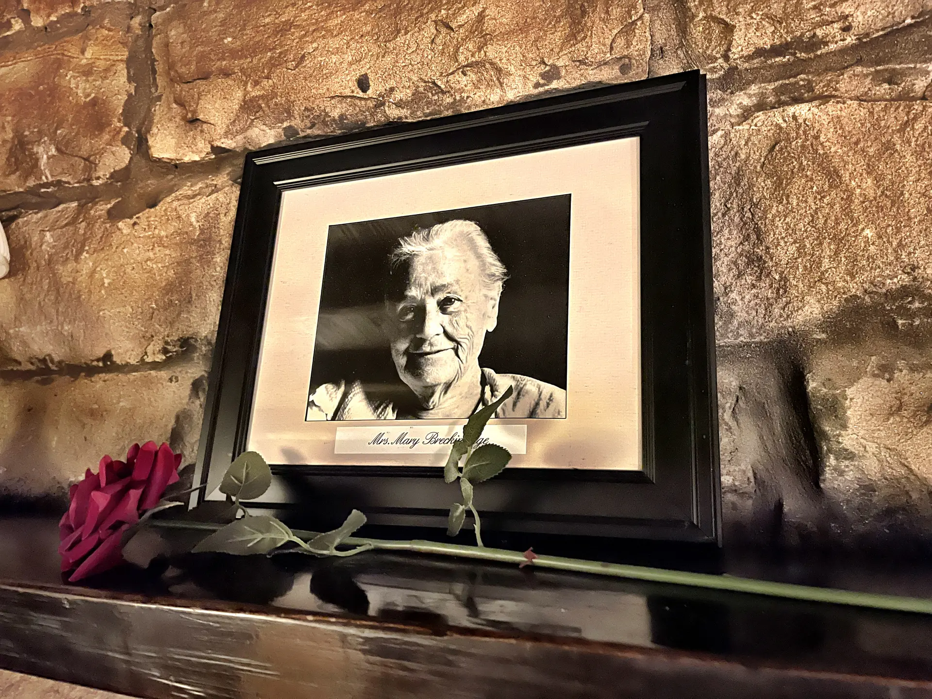 Framed portrait of Mrs. Mary Breckinridge with memorial rose